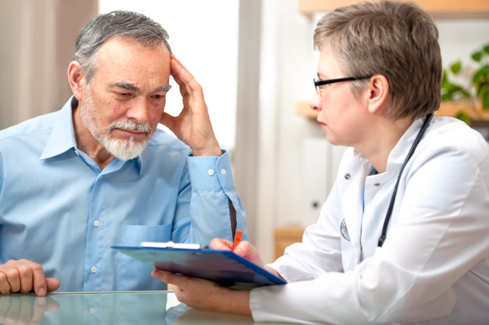 Doctor and patient reading a document